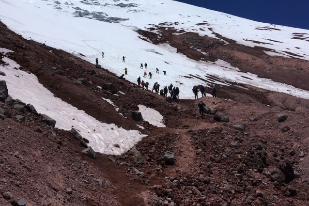 climbing snowcapes travelers climbing cotopaxi and reaching its summit