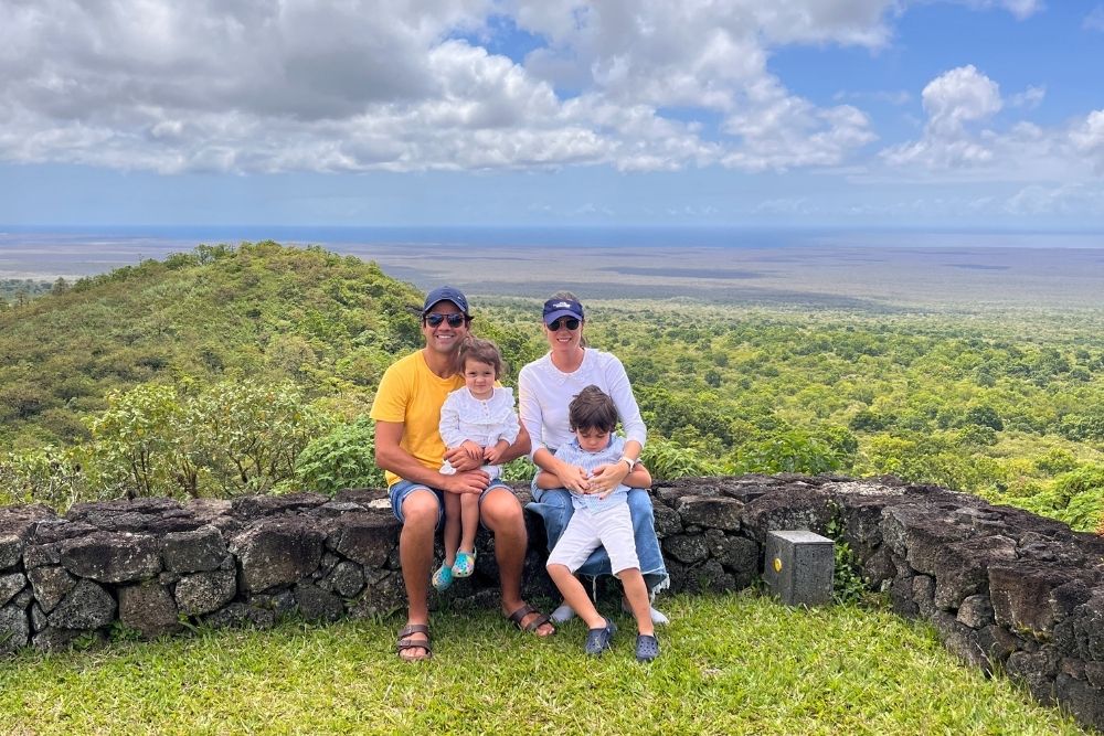 rebecca and her family from pikaia lodge family enjoying panoramic views from pikaia lodge, overlooking lush galapagos highlands and volcanic landscapes.
