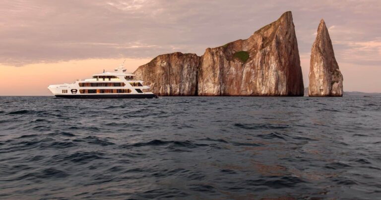 top galapagos cruise activities hermes yacht cruising around kicker rock in the galapagos islands.