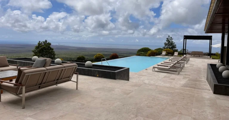 blog best galapagos hotels infinity pool and terrace overlooking volcanic landscape at one of the galapagos luxury hotels.